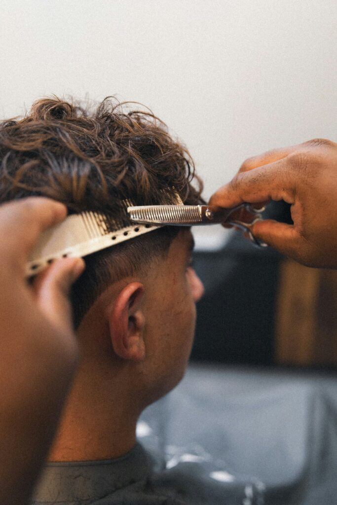 Blowout Low Taper Fade Curly Hair guide to haircut variations, curl maintenance, fade blending, barber tips, and trendy men's hairstyles.