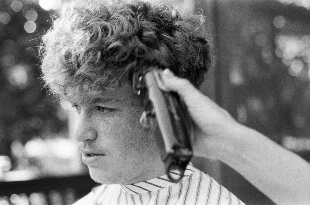Blowout Low Taper Fade Curly Hair covering curly fade styles, styling products, fade upkeep, grooming tips, and defined curls.