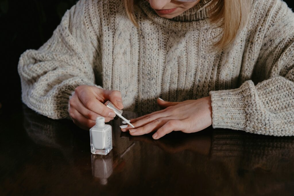 How to Get Nail Glue Out of Clothes covering dried glue removal, adhesive residue, fabric-safe cleaners, spot treatment, washing, and clothing care.